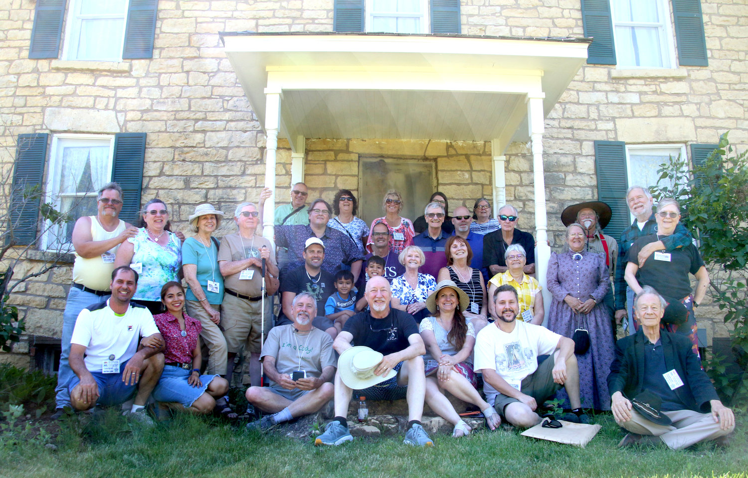 Cody descendants pose before Scott County's Cody Homestead June 18, during a stop on their four-day reunion to Buffalo Bill's birth county.