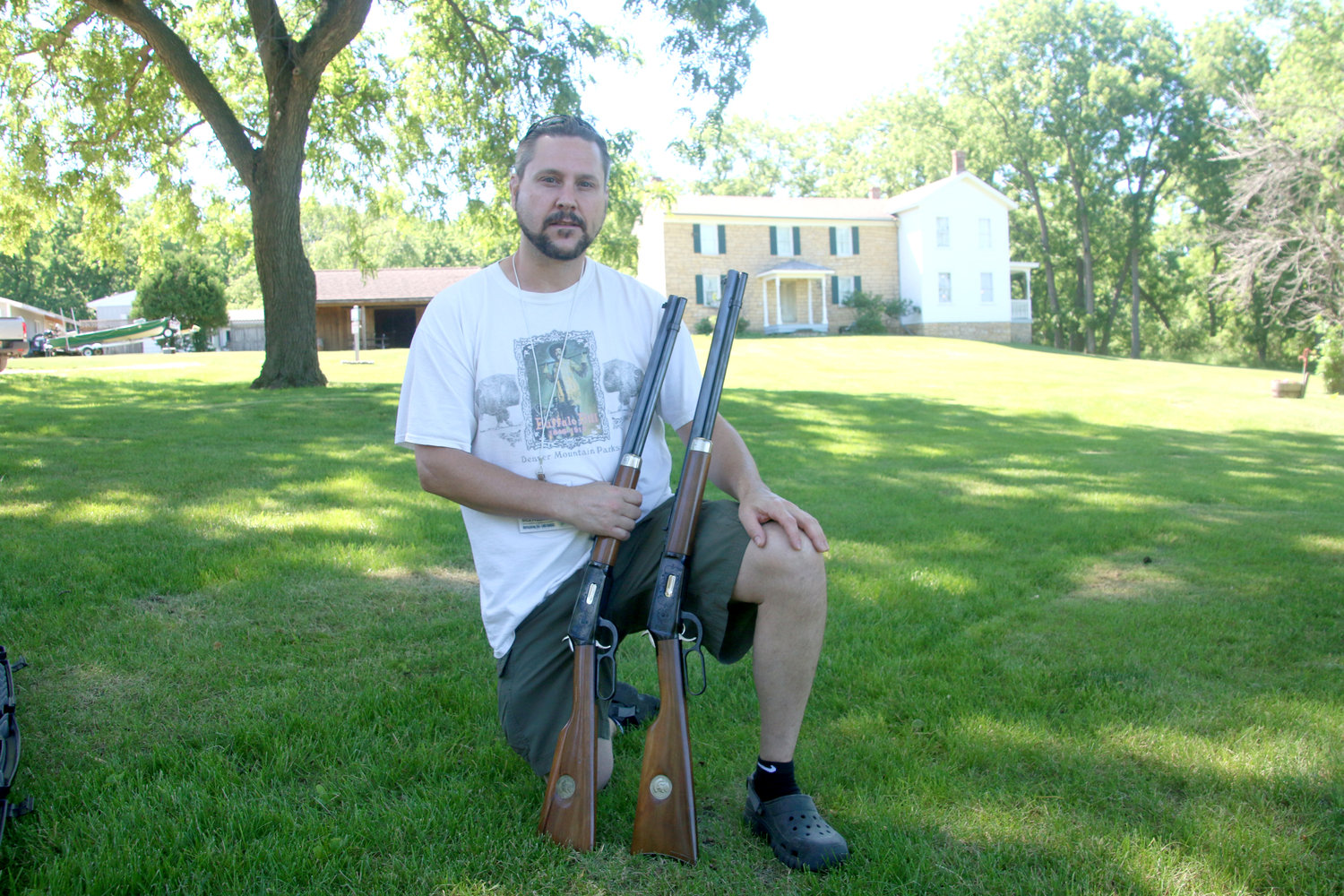 William “Kevin” Cody poses at the Cody Homestead with some Winchester Commemorative Buffalo Bill 30/30 Model 94 rifles after firing them earlier that morning at the Princeton shooting range.
