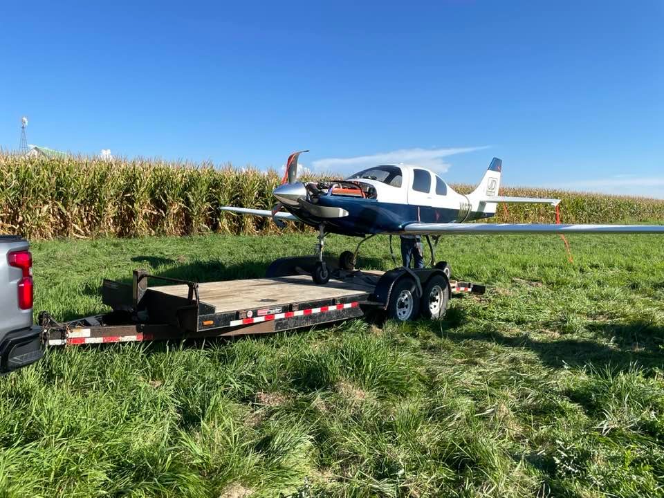 Jerry Coussens removes his plane from the field west of Eldridge where he crash landed Sept. 17.