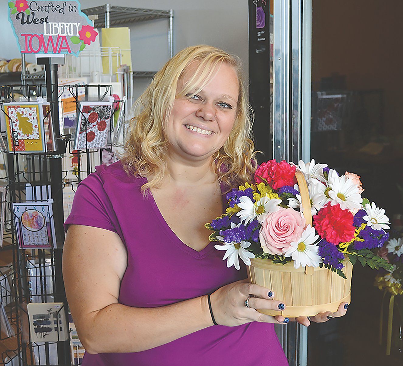 Flower Yard owner Destiny Brumbaugh with one of her floral bouquet creations she made. Brumbaugh worked for Jan McCrabb at Jan's Flower Yard for 20 years. She decided to open her own flower shop when McCrabb announced she was retiring.