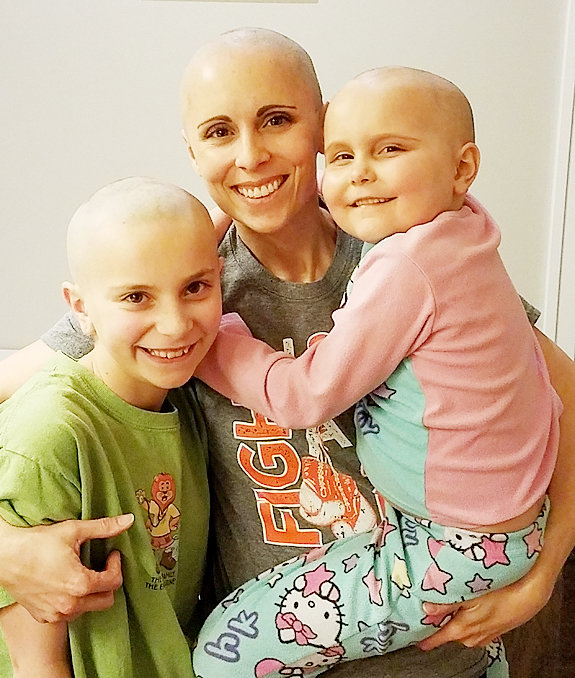 The entire Albrecht family shaved their heads in March of 2018, in support of what Kinley was going through. From left, Kinley's sister Kamryn, mom, Katie, and Kinley.