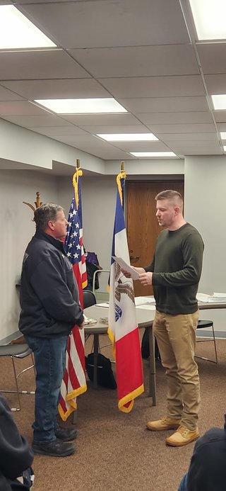 On the left is West Liberty Fire Chief Kirt Sickels being sworn in by West Liberty Mayor Ethan Anderson during the city council meeting Tuesday, March 7.