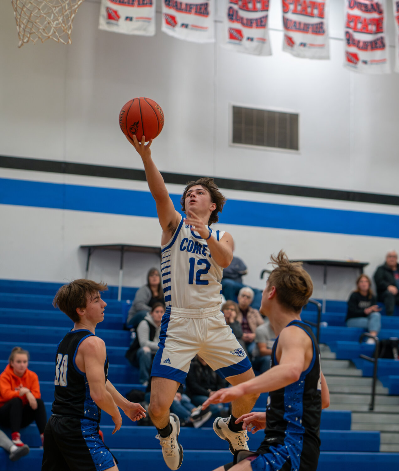Seth Axsom explodes to the rim in last week's double-Comet matchup against Bellevue.