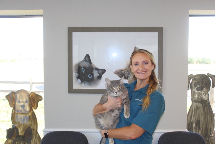 Dr. Whitney Jackson with Pampa Animal Hospital’s “mascot,” the three-legged cat Tres.