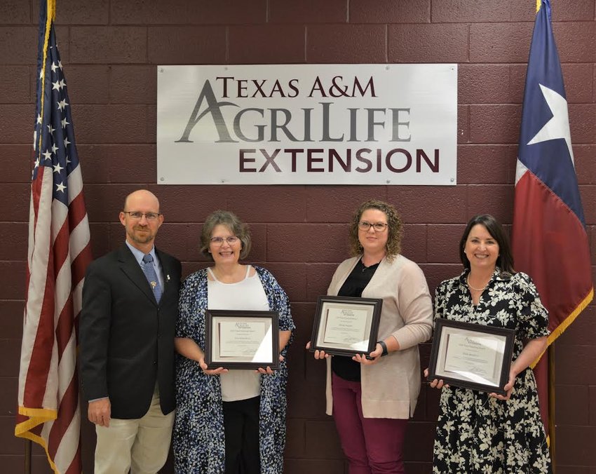 Above, Joan Gray-Soria (second from left) and colleagues receive accreditations for youth mental health first aid through the National Council for Behavioral Health.