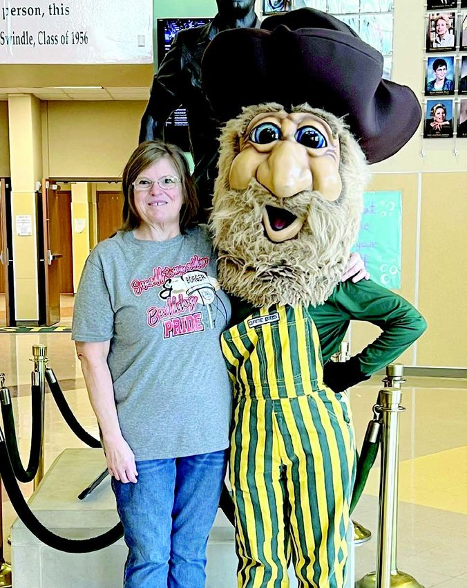 Mayor, Karen Felker of Borger poses with Harvey the  Harvester after defeat to Pampa in mayoral challenge