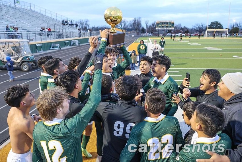 The Pampa Harvester Soccer team celebrates their victory.