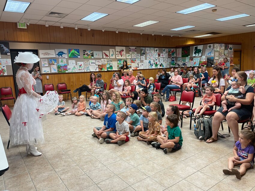 Stephanie Clinton, AKA &ldquo;Mary Poppins&rdquo; visited the Lovett Memorial Library on Monday to read and sing to children.