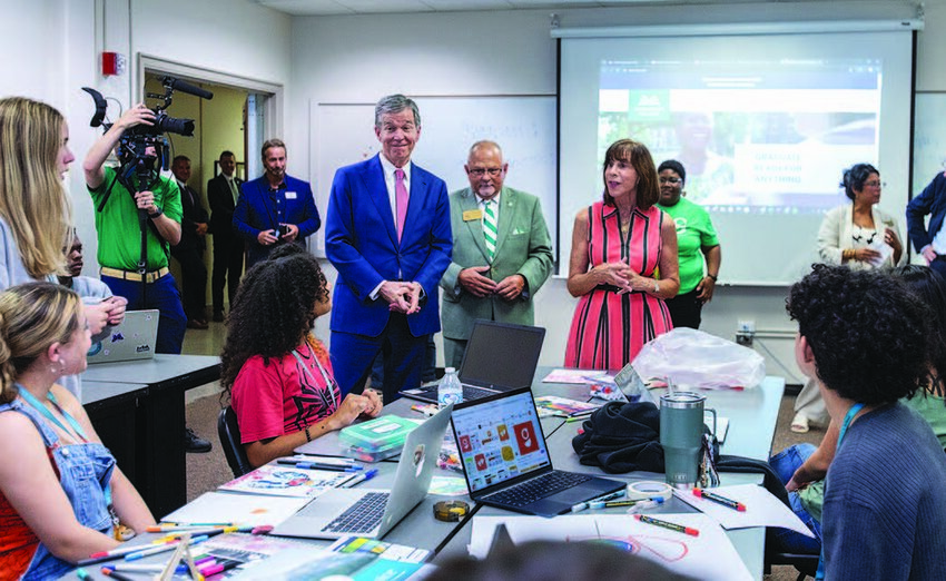 Speaking with students at Governor School West, Greensboro College, N.C. Gov. Roy Cooper, left, joined Greensboro College President Lawrence D. Czarda and U.S. Rep. Kathy Manning.