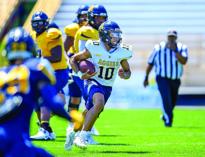 A&T’s Kevin White (#10, sophomore) throws and runs for a touchdown. White was one of five players in the quarterback position during the Blue & Gold game. Photo by Kevin Dorsey/ NCATSU Athletics.