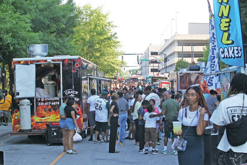 A plethora of people gather in downtown Greensboro for the Juneteenth Black Food Truck Festival held Saturday, June 15th.