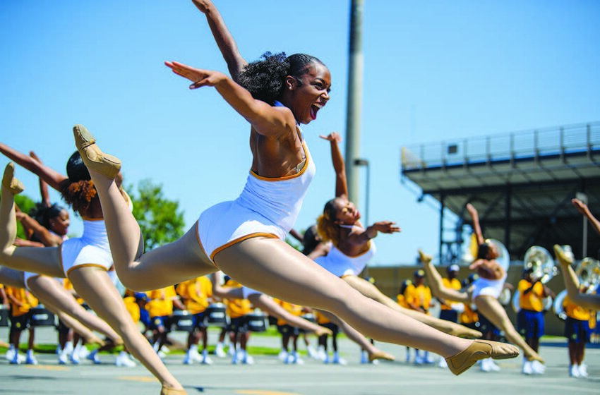 A Golden Delight Dancer of the Blue & Gold Marching Machine.