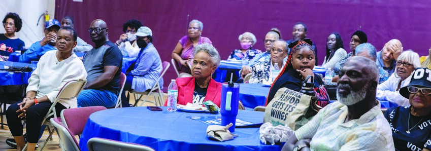 Danielle and Roy Jackson intently watch the Harris-Trump Debate at New Light Missionary Baptist Church.