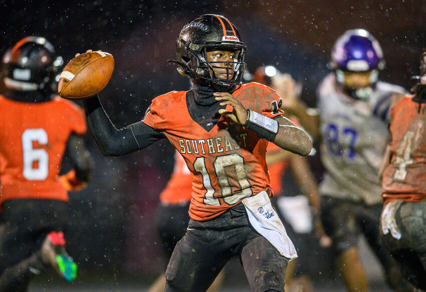 Southeast Guilford QB #10 Alexander Marsh drops back for a pass against Northern Guilford - Northern Guilford vs Southeast Guilford (2024 HS Football) - Photo by: Kevin L. Dorsey (Carolina Peacemaker)