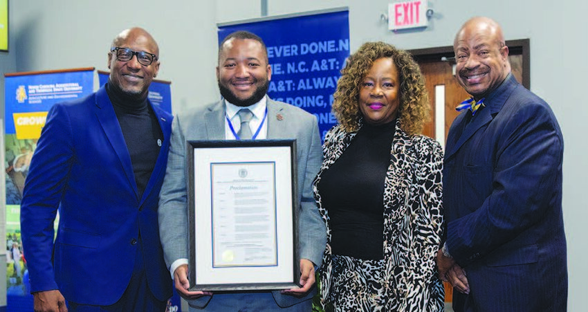 L-R: Bernard Bell, C. Cunningham, representing N.C. A&T; Dr. Benita Bell, and Dr. Calvin A. Bell.