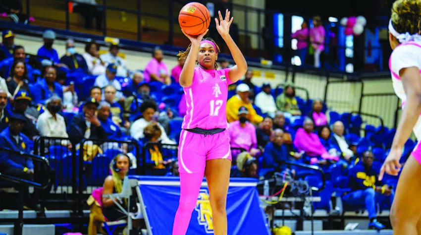 Ajia James (#12) connects for one of her four 3-pointers in A&T’s win over Delaware on Sunday (Feb. 23).