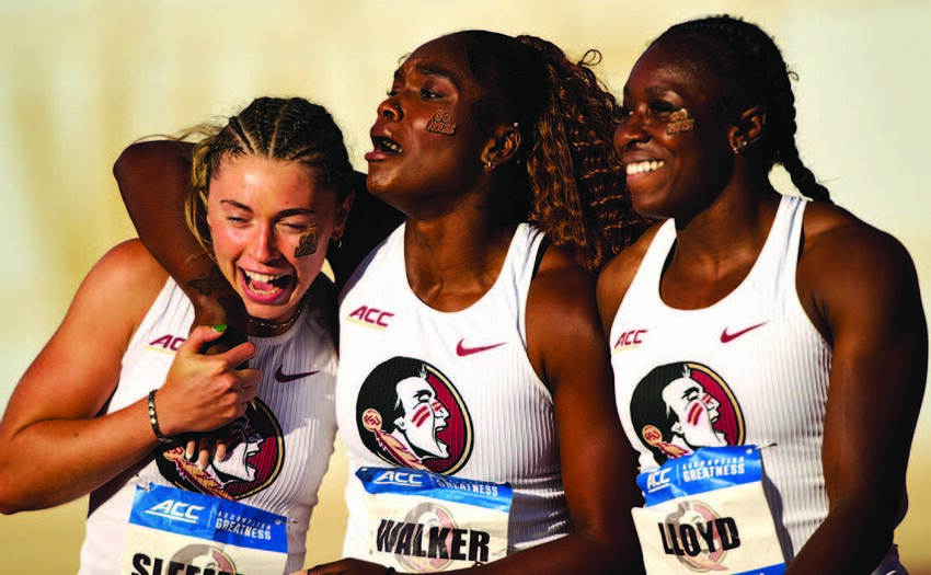 Florida State track and field teammates Lucy May Sleeman, Shenese Walker, and Loella Lloyd celebrate after running the women’s 100m.