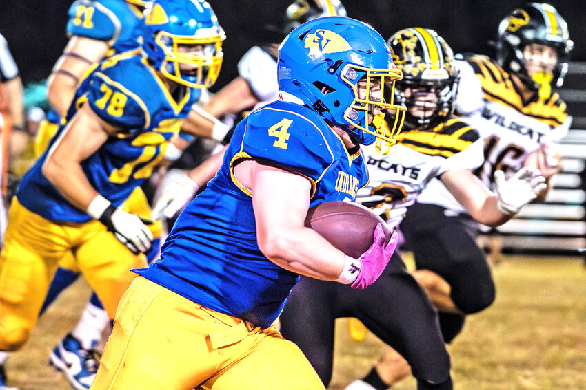 Eli Abernathy (4) makes an 89-yard run down the sideline for a touchdown at Friday’s game against the Cuba Wildcats.