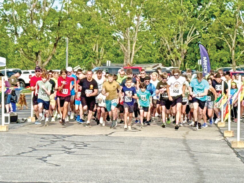 Around 200 runners and walkers took part in the Mayfest 5K Run/Walk held May 10 under sunny skies at Perry Center. Once the race began, the participants made their way around the course at varying speeds. The race was sponsored by First State Community Bank.