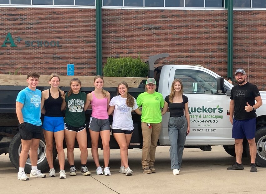 Student volunteers who took part in a recent campus cleanup day are pictured with Principal Shadrick Shafer who coordinated the effort with the help of Kueker&rsquo;s Nursery &amp; Landscaping.