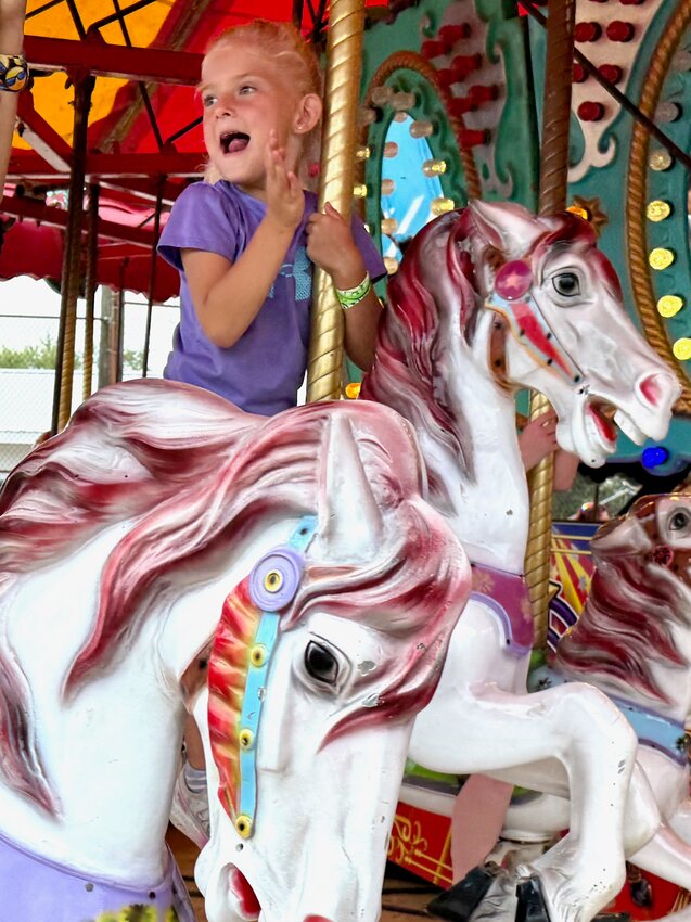 This young lady appears to be having the time of her life riding on the carousel at this year’s East Perry County Community Fair.