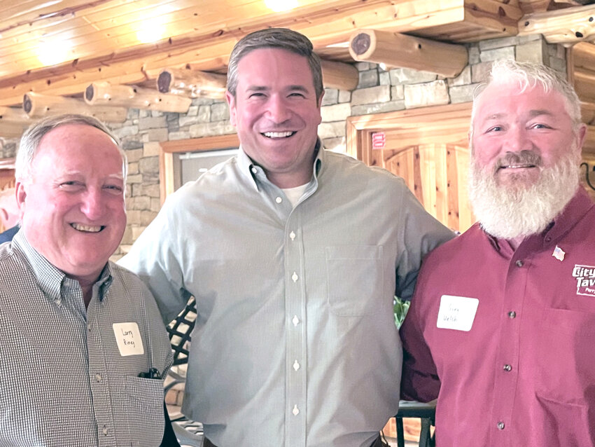 Missouri Attorney General Andrew Bailey (center) is flanked by Perryville Mayor Larry Riney (left) and City Tavern owner Gary Welch. Bailey attended a reception held in his honor last week at Richardet Floor Covering.