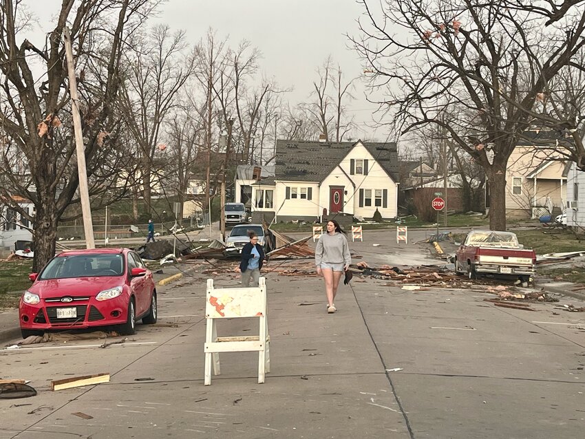 Stunned Perryville citizens walk the streets surveying the damage caused by a strong storm and EF2 tornado that hit the city beginning around 10 p.m. Friday and continued through the early morning hours of Saturday.