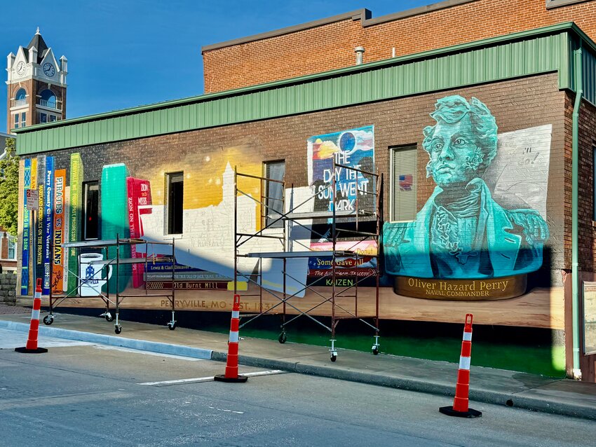 This mural on the wall of the Perryville Chamber of Commerce at the junction of Ste. Maries and North Main streets comes is closer to completion by press time Tuesday. The artists working on the mural set the goal of finishing it by the start of Mayfest.