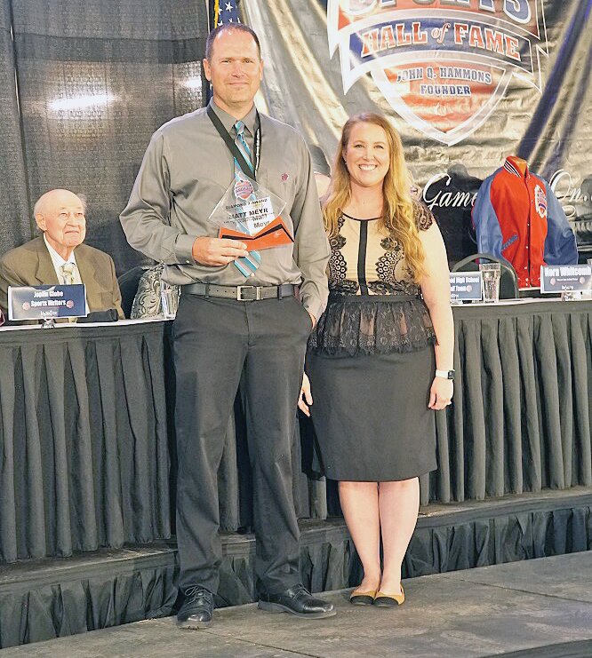 Perryville High School alum Matt Meyr is presented with the Diamond 9 Award by Missouri Sports Hall of Fame executive vice president Kari Norris during the Hall’s annual Baseball and Softball Luncheon at the new Wilson Logistics Arena, part of the Ozark Empire Fairgrounds, in Springfield on May 21.