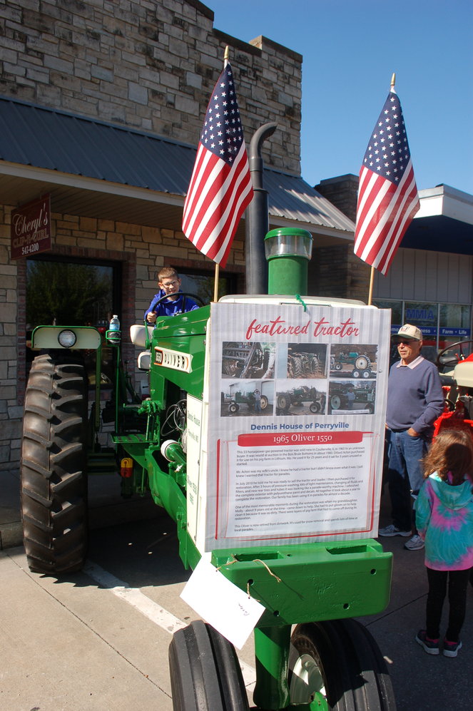 Dennis House, right, of Perryville presented his 1965 Oliver 1550 Saturday, May 7, at the 2022 Mayfest tractor show.