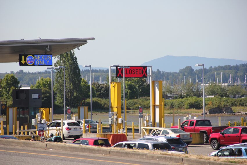 Vehicles enter the U.S. at the Peace Arch border crossing on July 20, 2023.