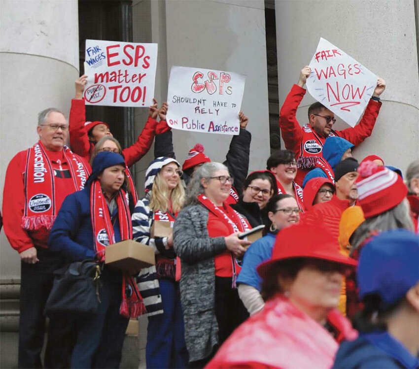 Bus drivers, custodians, cafeteria staff, paraeducators and teachers demand fair wages outside of the Capitol February 19.