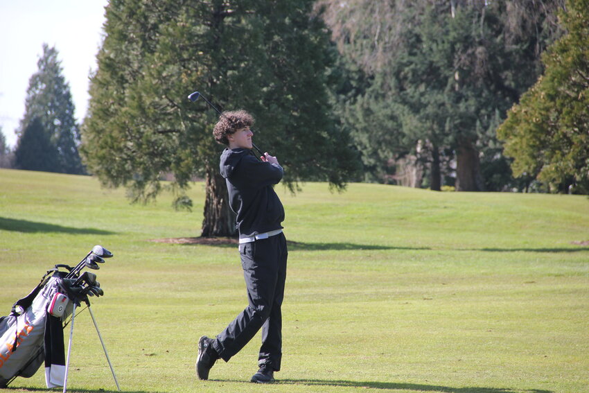 Senior Uno Navarez watches his approach shot during Blaine’s first golf meet of the season at Semiahmoo Golf and Country Club.
