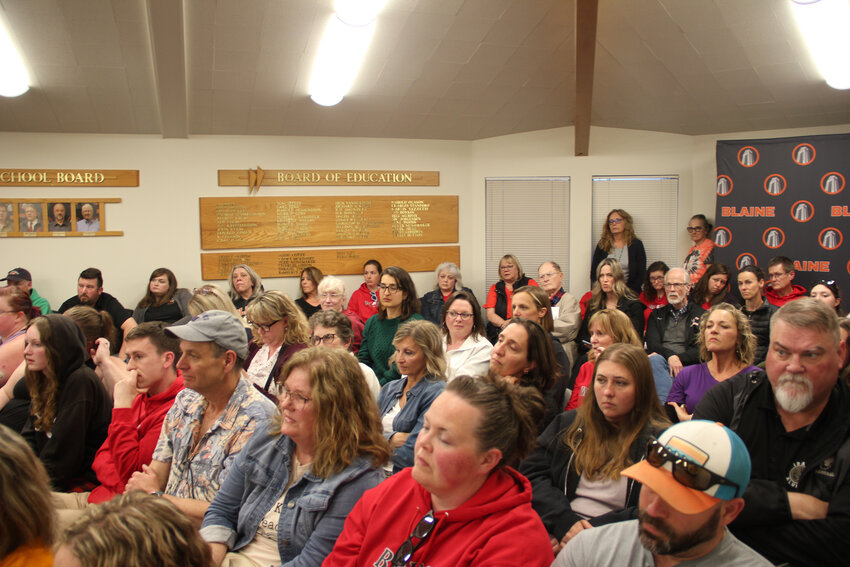Members of the community joined Blaine teachers, classified staff, and administrators in attendance for the April 22 school board meeting. A vote by the board to approving cutting 30 positions to free up $2.5 million of the district’s budget was postponed for Monday, April 29.