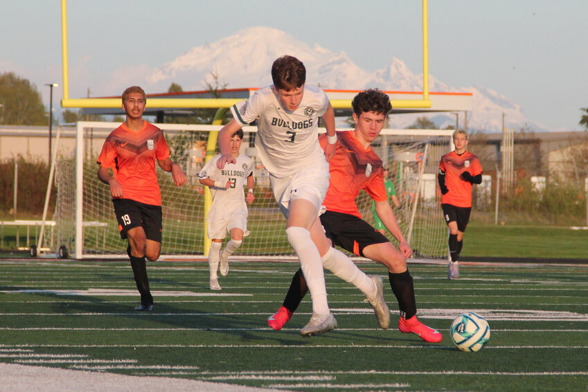 Blaine junior defender Jacob Troupe, r., jostles for the ball against a Mt. Vernon forward during Blaine’s 1-0 loss on April 22.