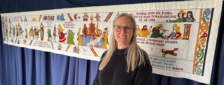 Claudia Pétursson with the traveling tapestry depicting the ‘Njals saga’ she is presenting across North America, including at Blaine Public Library on Thursday, May 22.
