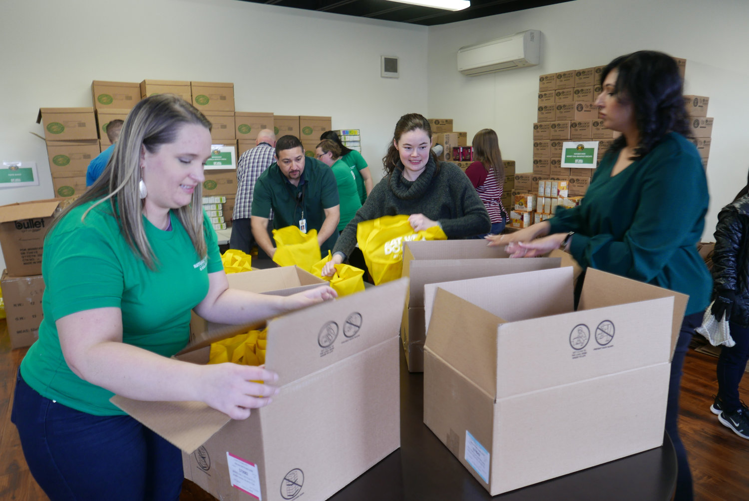Employees at Nature’s Path in Blaine recently packed boxes with breakfast bars, biscuits, cereal and oatmeal for food-insecure middle schoolers in the Ferndale School District.