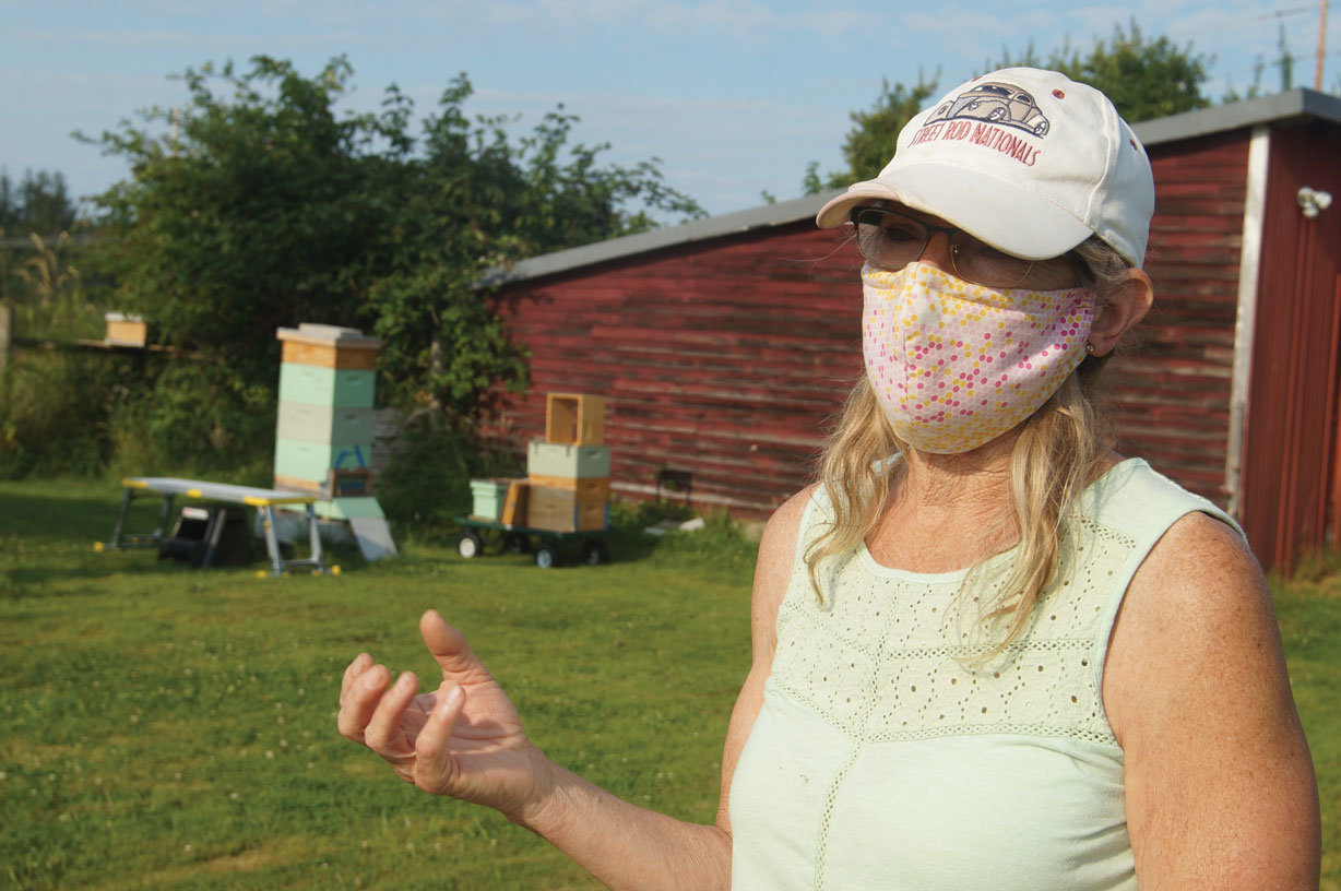 Ruthie Danielsen tends to the six beehives on her Birch Bay property, about a mile from where the Asian giant hornet was caught in a WSDA bottle trap.