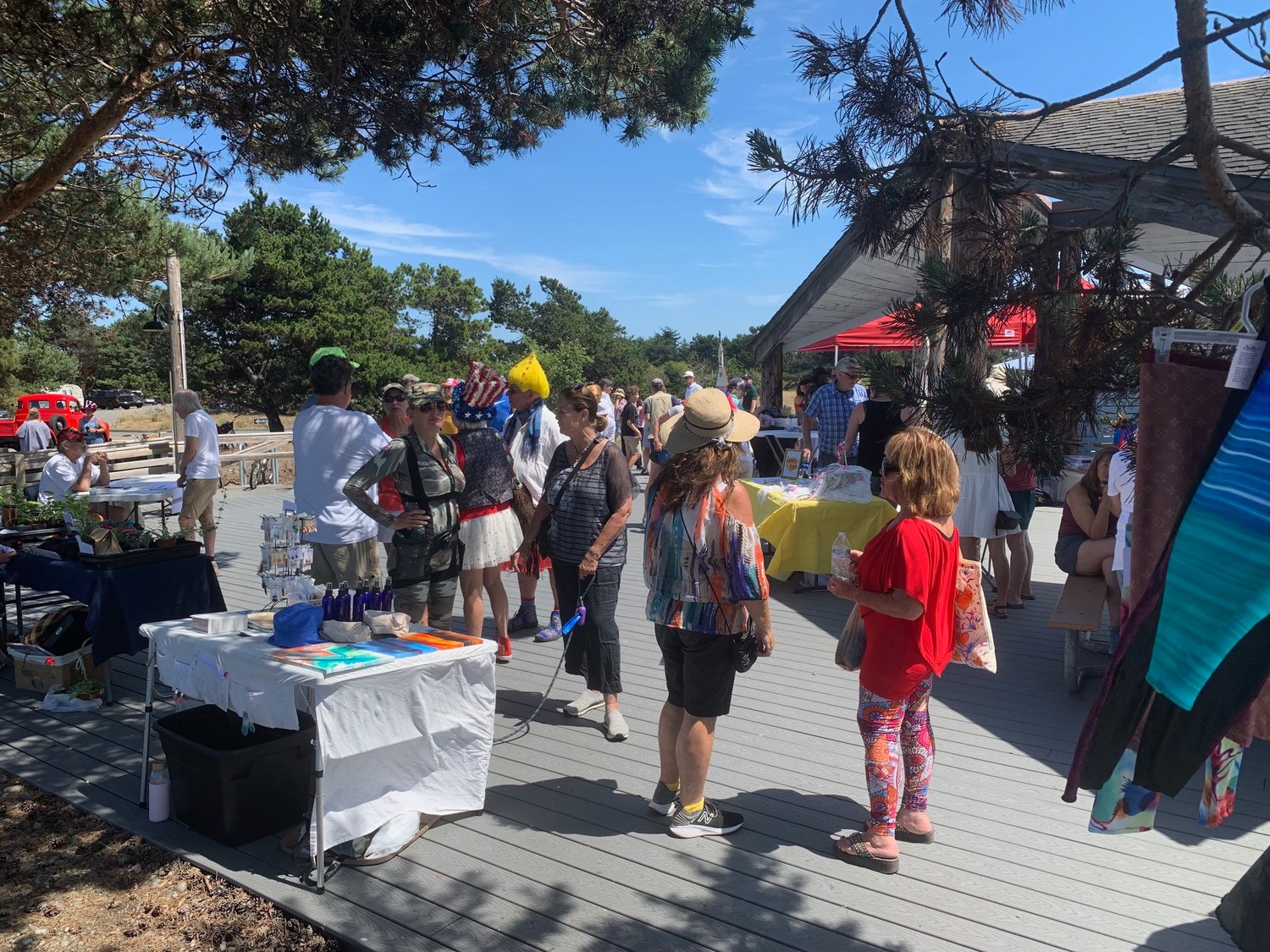 Point Roberts residents enjoy the firefighter BBQ and Artisan Market at the Lighthouse Marine Park boardwalk.