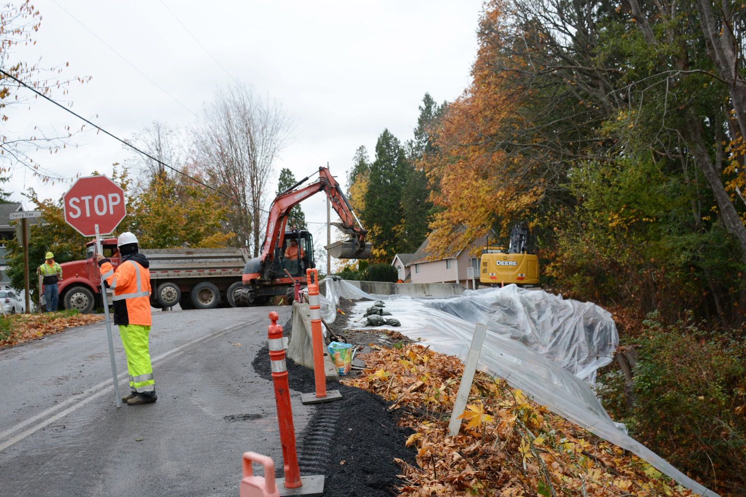 Stremler Gravel crew lay material for a temporary travel lane on Deer Trail in October 2021 to allow for two-way traffic while Whatcom County Public Works Department makes plans for a permanent fix to eroding roadway.