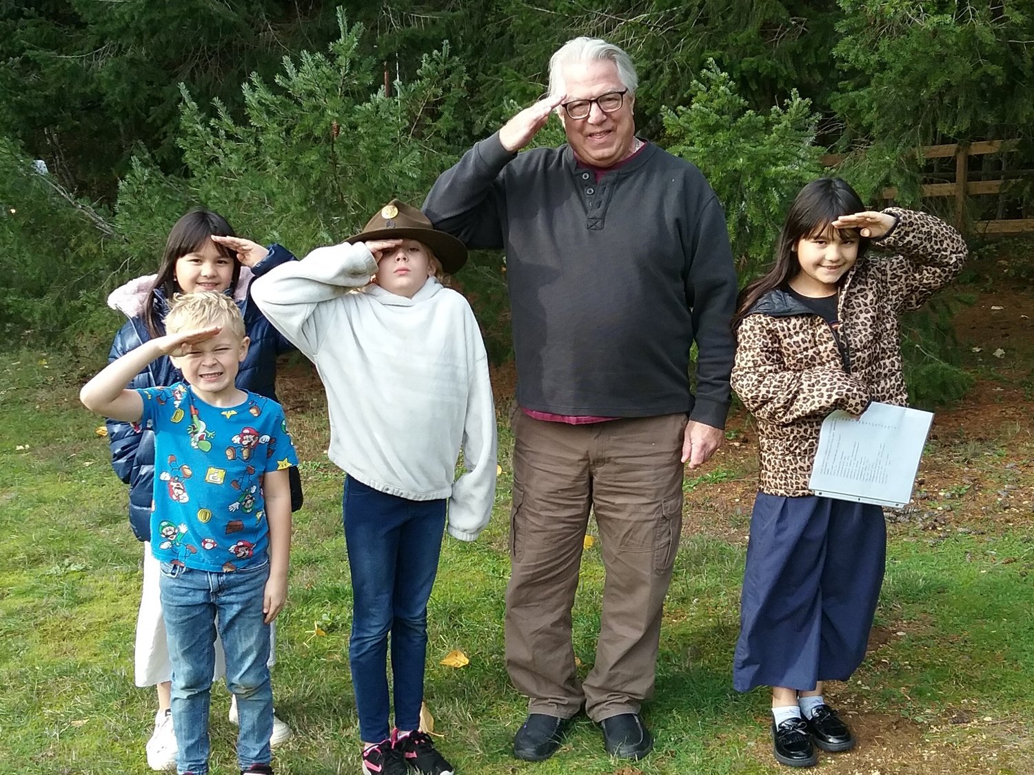 Local children placed flags on 18 Veterans' graves at the Point Roberts cemetery with guidance from a district commissioner. Bill Zidell stopped by to pay his respect and show the kids his Army Rangers hat.
