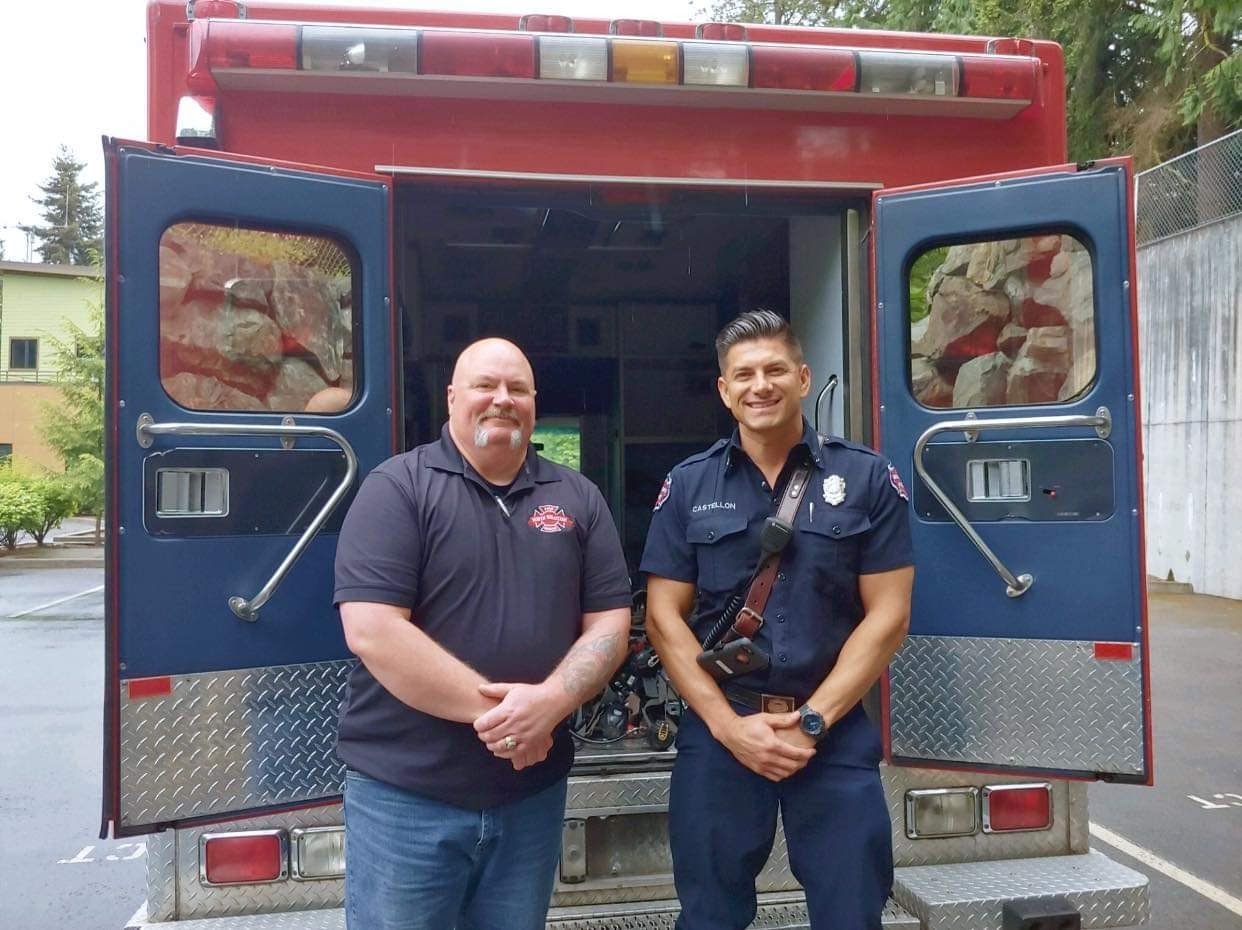 North Whatcom Fire and Rescue (NWFR) commissioner John Crawford, l., and nonprofit Firefighters Crossing Borders CEO Moi Castellon. NWFR donated an ambulance and two fire apparatus engines in 2020 to Unión de Tula, Mexico. The city recognized NWFR for the donations in 2021.