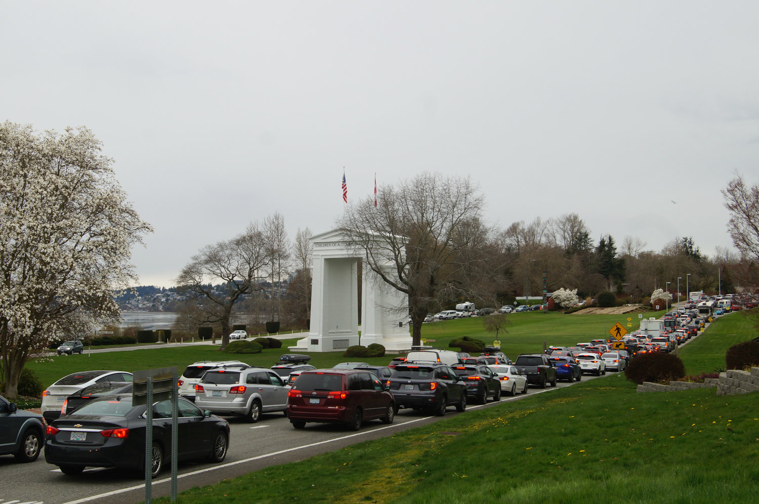 Travelers lined up to enter Canada in April 2022, the day the Canadian government dropped its antigen testing requirement for fully vaccinated travelers. Over 7,400 vehicles crossed both ways through the Peace Arch border crossing on April 1, according to data from Cascade Gateway.