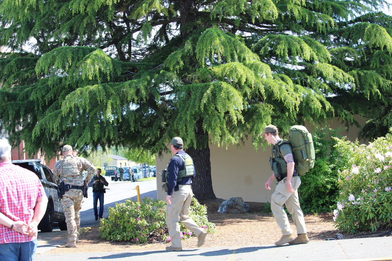 U.S. Border Patrol agents surround Blaine school district’s main campus on May 25. U.S. Border Patrol, U.S. Customs and Border Protection, Whatcom County Sheriff’s Office and Blaine Police Department responded to the school district’s threat.