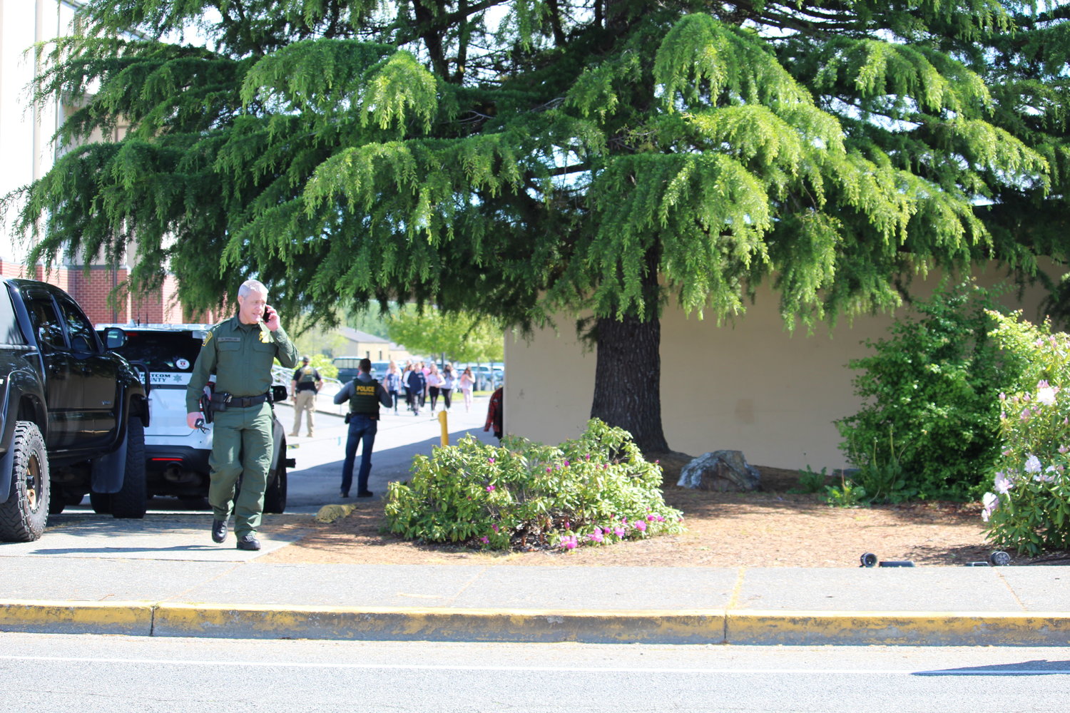 A U.S. Border Patrol agent outside Blaine school district's main campus on May 25.