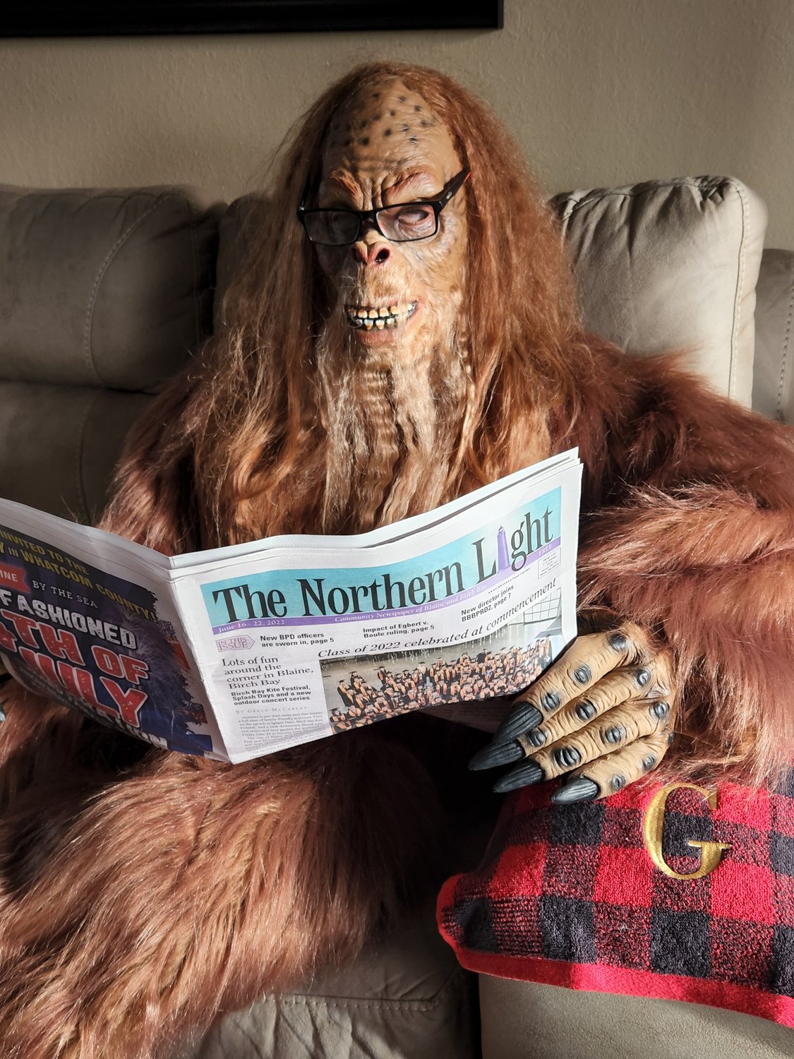 Blaine’s own Bigfoot, AKA Greg Nuzum, reads the June 16 issue of The Northern Light newspaper.