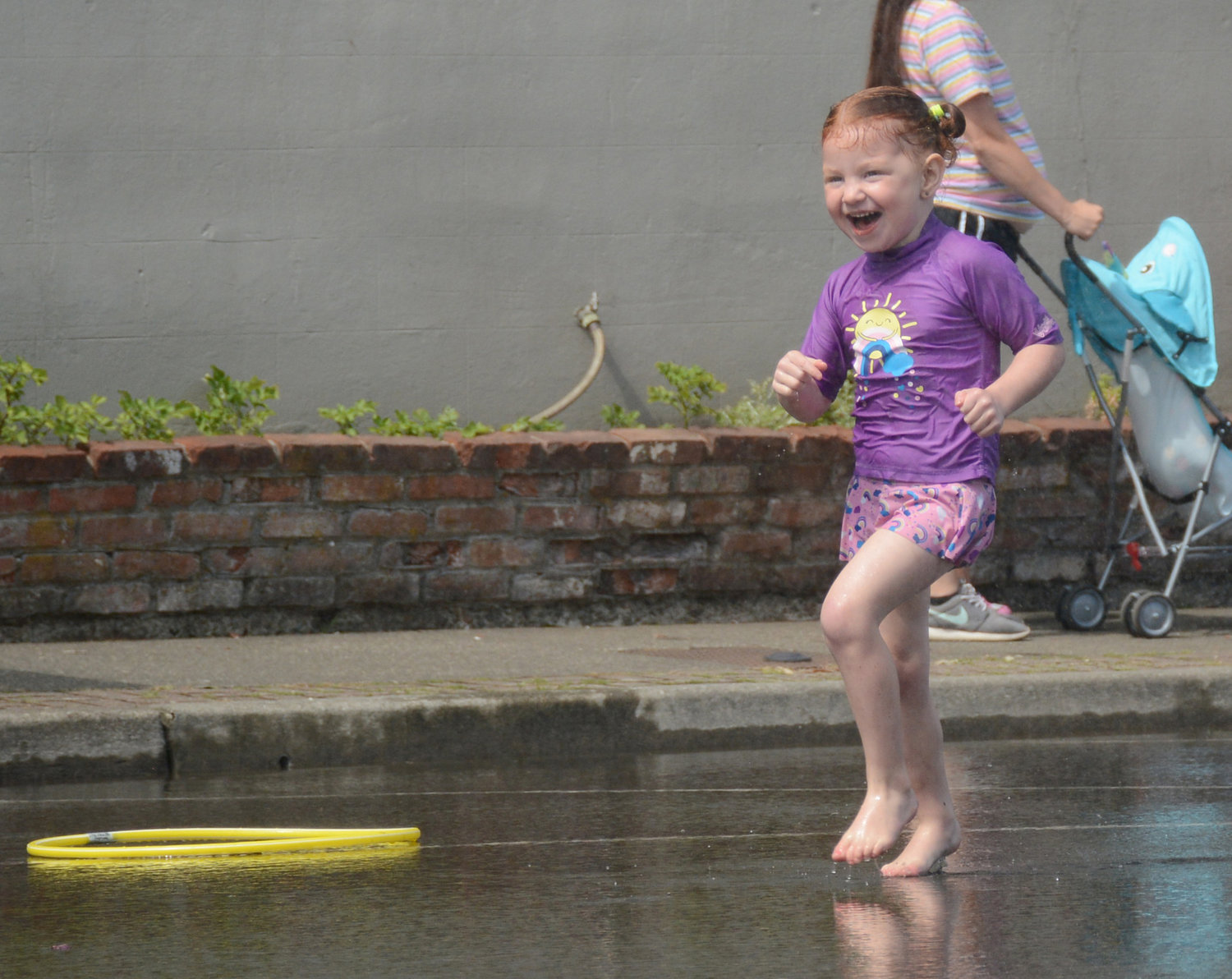 Children run through sprinklers and fire hydrants on 3rd Street in downtown Blaine during Splash Days, put on by Blaine-Birch Bay Park and Recreation District 2 and the city of Blaine August 12.