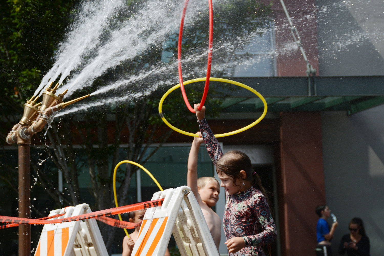 Children run through sprinklers and fire hydrants on 3rd Street in downtown Blaine during Splash Days, put on by Blaine-Birch Bay Park and Recreation District 2 and the city of Blaine August 12.