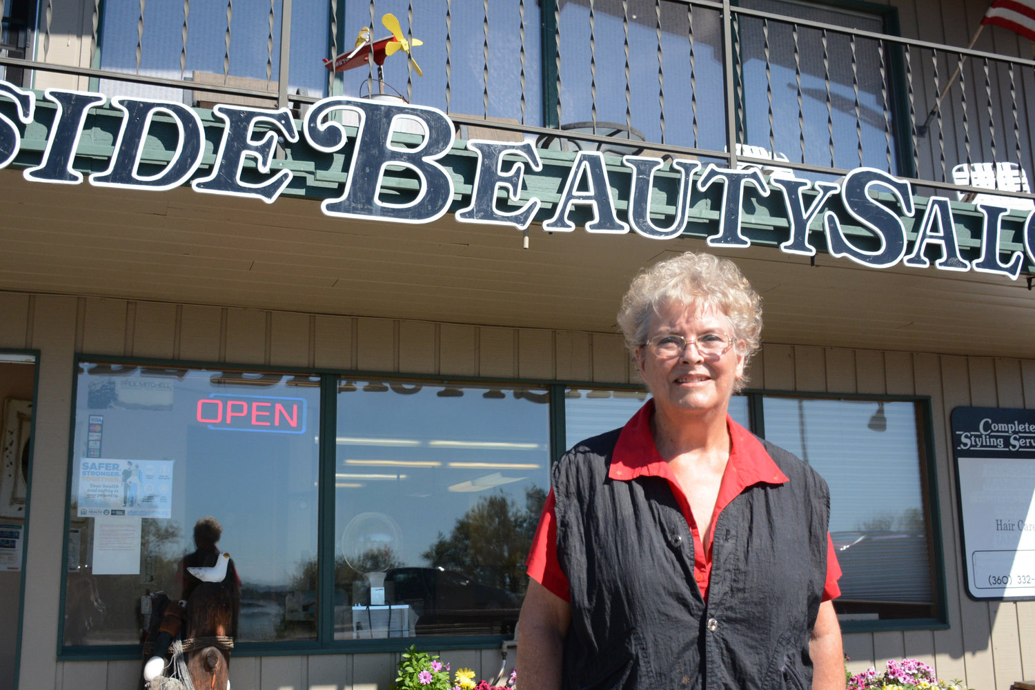 Judy Dunster in front of Bayside Beauty Salon. She opened the salon August 1, 1972.