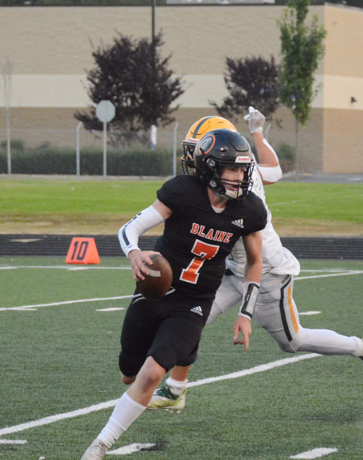 Senior quarterback Kael Evinger avoids the Mariner blitz and looks for a pass in the Borderites’ 49-6 loss to Sehome.
